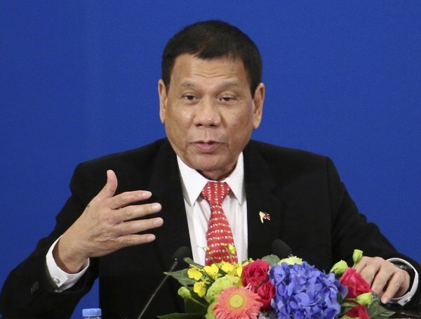 菲律賓總統杜特蒂獲中國高額資金協助後，25-27日將訪日與安倍會談，期盼獲得更多資源協助開發建設菲國。圖／美聯社
